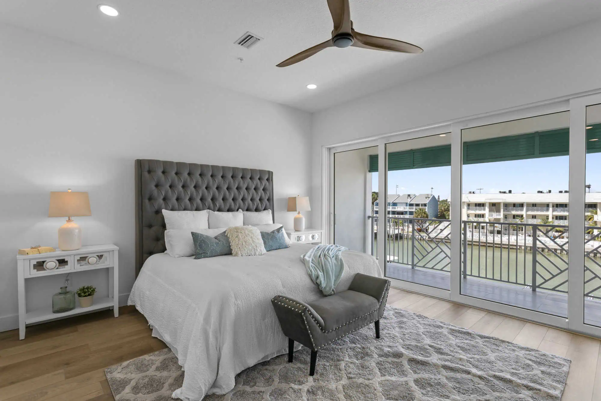 Master bedroom with balcony view by BA Construction, Pinellas County.